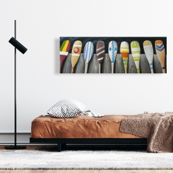 Canvas 16 x 48 - Colorful paddles on the dock