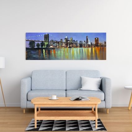 Colorful city with a bridge by night