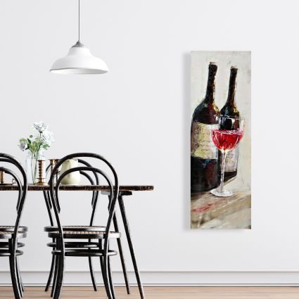 Two bottles with a glass of wine