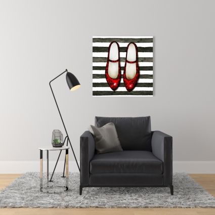Red glossy shoes on striped background