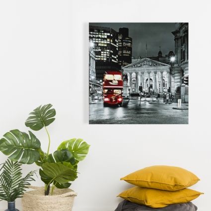 Grayscale pantheon with red bus
