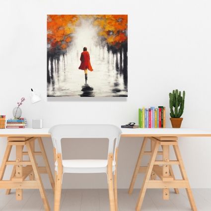 Femme avec un manteau rouge en automne