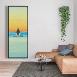 Framed 20 x 60 - A surfer swimming by dawn