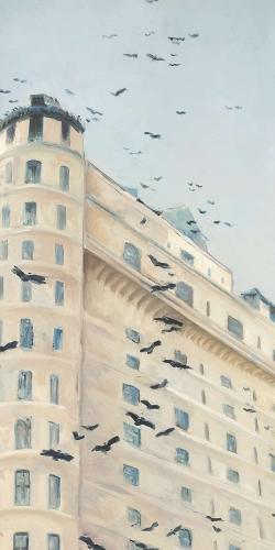 Birds flying in front of a building