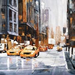 Big city street with yellow taxi