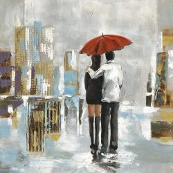 Couple walking under their umbrella