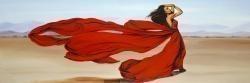 Woman with a long red dress in the desert