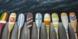 Colorful paddles on the dock