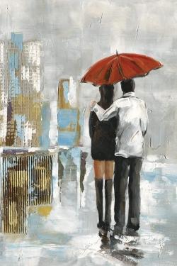 Couple walking under their umbrella
