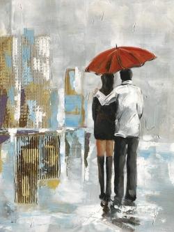 Couple walking under their umbrella