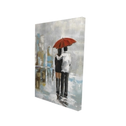 Couple walking under their umbrella