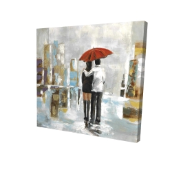 Couple walking under their umbrella