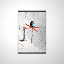 Man skiing in steep offpiste terrain