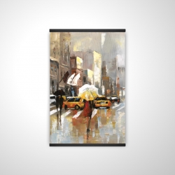People with umbrellas walking across the street