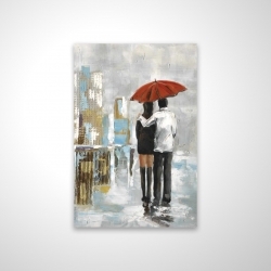 Couple walking under their umbrella