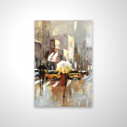 People with umbrellas walking across the street