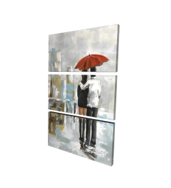Couple walking under their umbrella